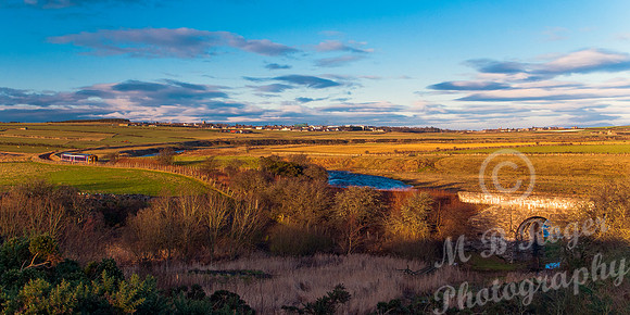 River Thurso leading into Thurso with train leaving
