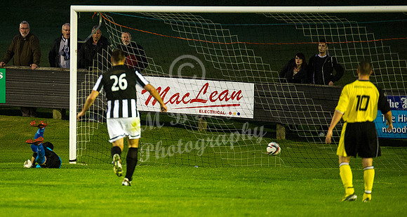 Lukasz Geruzel watches Bryan McKiddie's shot cross the line