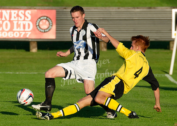 Wick's Gary Manson and Clachs Martin Laing