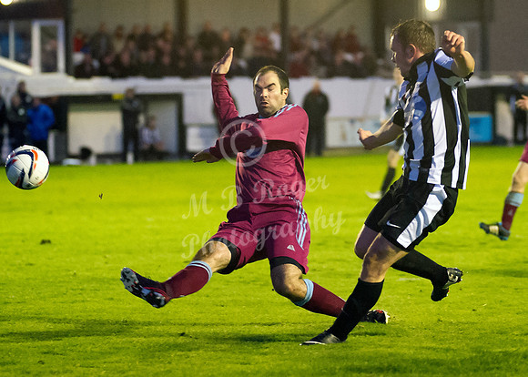 Highland League (SHFL) football match Wick Academy FC and Keith FC played at Harmsworth Park Wick home of the Scorries.  Stuart Walker of Keith is unable to cut out the cross of Wick's Richard MacAdie