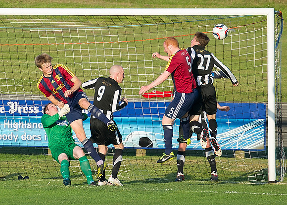 Friendly pre-season match between Wick Academy and Livingstone played at Harmsworth Park home of Highland League team Wick Academy. Wick Goal keeper James More fouled as James Pickles cleares for Acad
