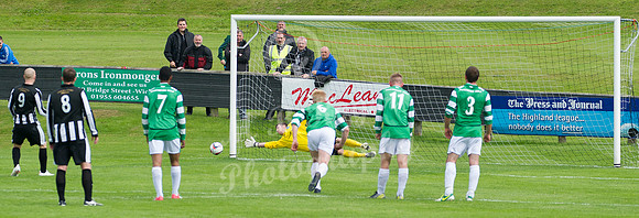Buckie keeper Kevin Main saving penalty by Wick's Gary Weir
