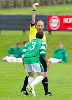 Buckie's Iain MacRae being booked by Referee Graham Elder
