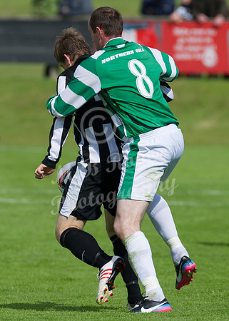 Buckie's James Showan keeping tight hold of Wick's James Pickles