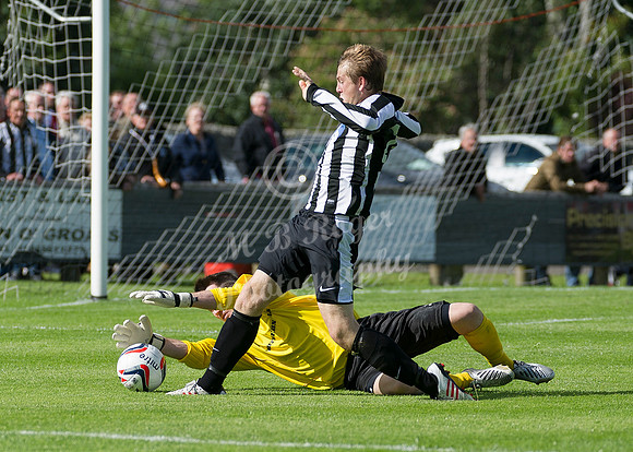 Buckie keeper Kevin Main saves at the feet of Wick's James Pickles