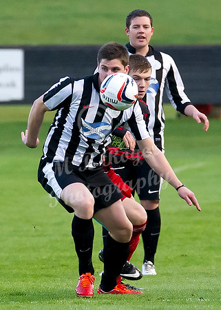 Wick Academy 2 v Inverurie 2  SHFL 23/11/2013<br/>Wick's Grant Steven checks out his next move under pressure from Inverurie's Andrew Hunter