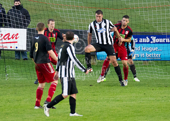 Wick 2 v Inverurie 2  SHFL 23/11/2013<br/>Inverurie's Ross Anderson holding Wick's Lukasz Geruzel