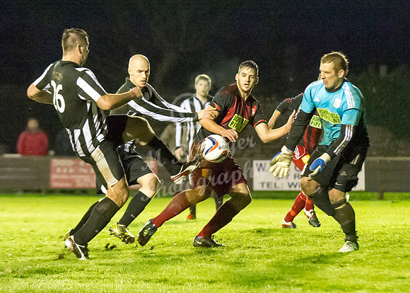 Wick 2 v Inverurie 2  SHFL 23/11/2013<br/>Wick's Lukasz Geruzel reaches the ball before the oncomin Inverurie keeper Andy Reid