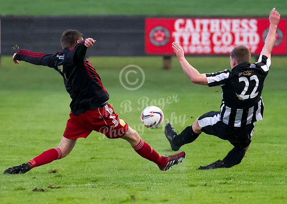 Wick 2 v Inverurie 2  SHFL 23/11/2013<br/>Wick's Michael Steven and Inveruruie's John Maitland stretch for the ball
