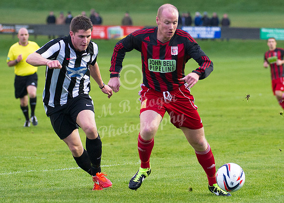 Wick Academy 2 v Inverurie 2  SHFL 23/11/2013<br/>Inverurie's Matin Bavidge being closely watched by Wick's Grant Steven