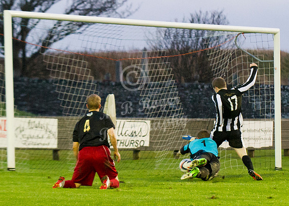 Wick 2 v Inverurie 2  SHFL 23/11/2013<br/>Inverurie keeper dives desparingly at Ross Allan's feet as the Wick man beats him to the ball  and steers the ball into the back of the net for Wick's second