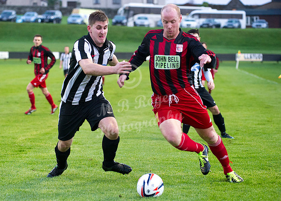 Wick 2 v Inverurie 2  SHFL 23/11/2013<br/>Inverurie's Martin Bavidge trying to get around Wick's Michael Steven