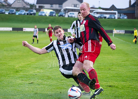 Wick Academy 2 v Inverurie 2  SHFL 23/11/2013<br/>Wick's Michael Steven clears the ball from the toe of Inverurie's Martin Bavidge