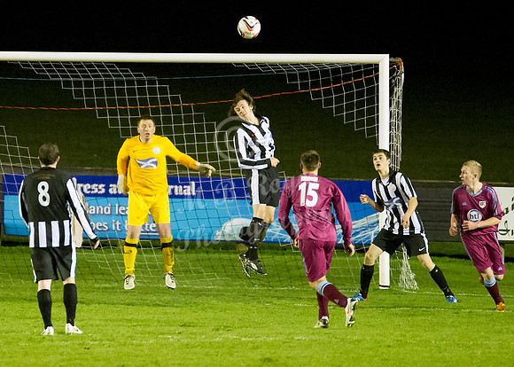 Highland League (SHFL) football match Wick Academy FC and Keith FC played at Harmsworth Park Wick home of the Scorries.  clearing header by Wick's Shaun Sinclair