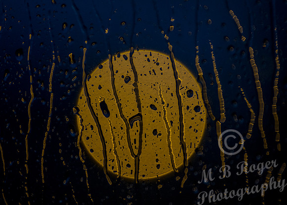 streetlight thru rainy window