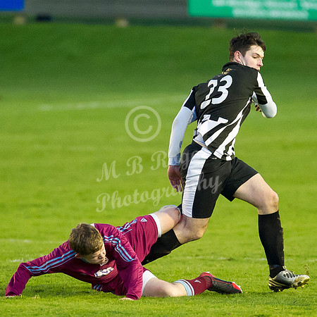 Highland League (SHFL) football match Wick Academy FC and Keith FC played at Harmsworth Park Wick home of the Scorries.  Wick's Sam Mackay caught by the late takle of Keith's Zander Jack