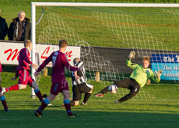 Highland League (SHFL) football match Wick Academy FC and Keith FC played at Harmsworth Park Wick home of the Scorries.  Keith's keeper Iain MacLeod saves with his legs from a shot by Wick's Craig She