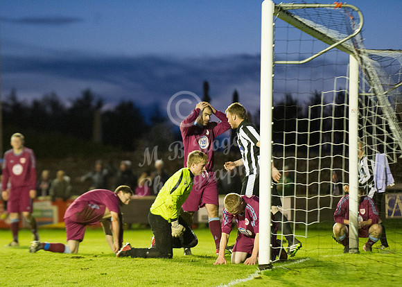 Highland League (SHFL) football match Wick Academy FC and Keith FC played at Harmsworth Park Wick home of the Scorries.  Keith players can't hide their disappointment as the ball ends up in the net fr