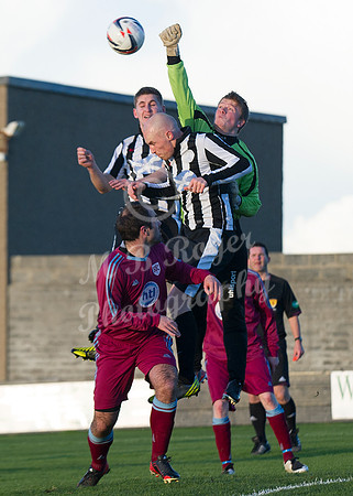 Highland League (SHFL) football match Wick Academy FC and Keith FC played at Harmsworth Park Wick home of the Scorries.  Keith keeper Iain MacLeod rises high to punch clear under the challenge of Wick