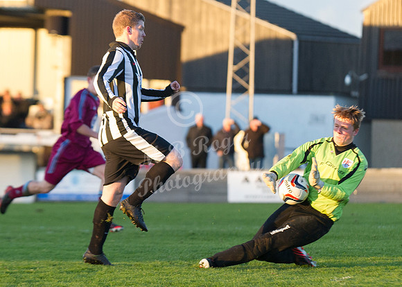 Highland League (SHFL) football match Wick Academy FC and Keith FC played at Harmsworth Park Wick home of the Scorries.  Keith keeper Iain MacLeod narrows the angle and saves at point blank range from
