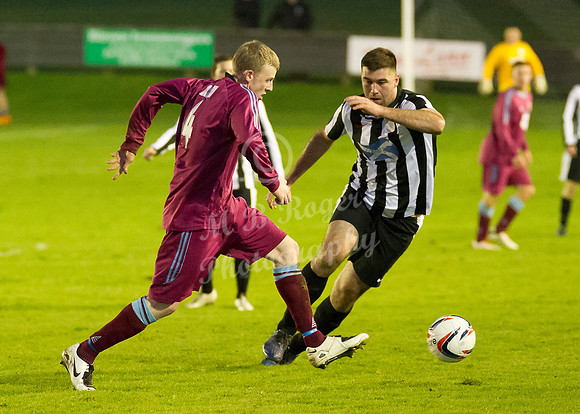 Highland League (SHFL) football match Wick Academy FC and Keith FC played at Harmsworth Park Wick home of the Scorries.  Keith's Craig Phillips and Wick's Lukasz Geruzel chase the loose ball